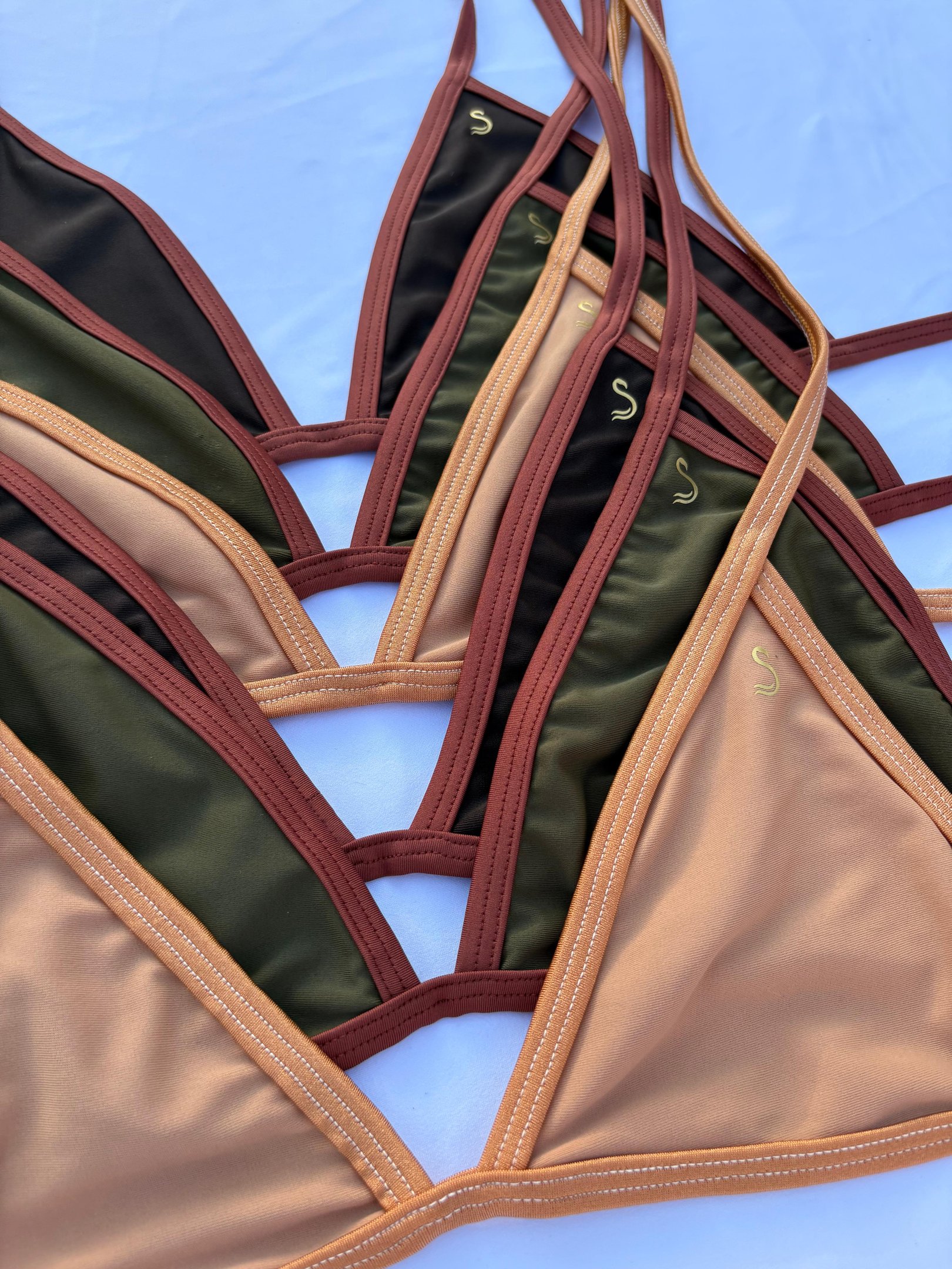 a person holding a piece of clothing with a name on it