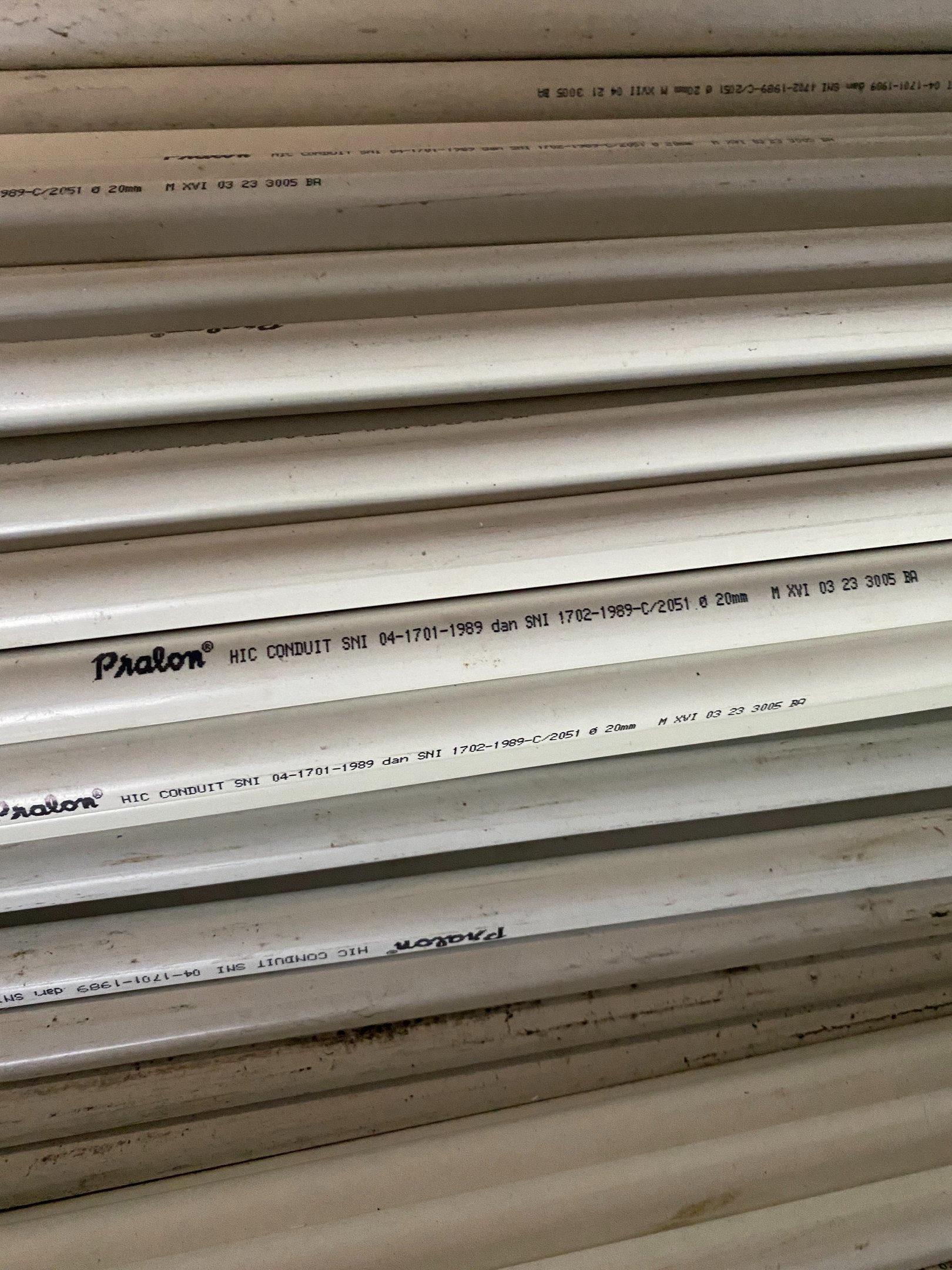 a stack of pipes and pipes in a warehouse Distributor Pralon