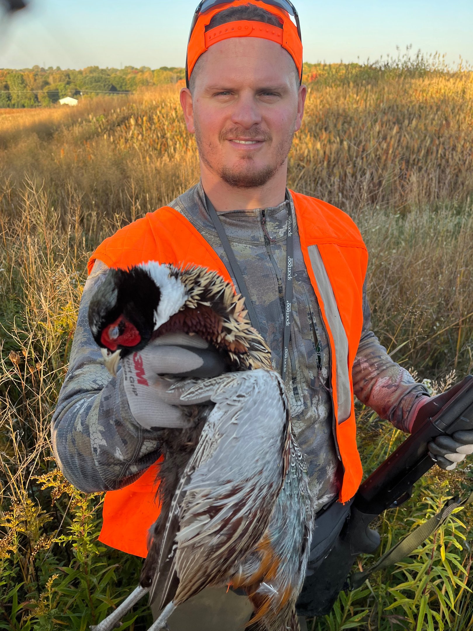 Boss Pressure Washing LLC owner Torsten Boss wearing blaze orange hunting gear outdoors