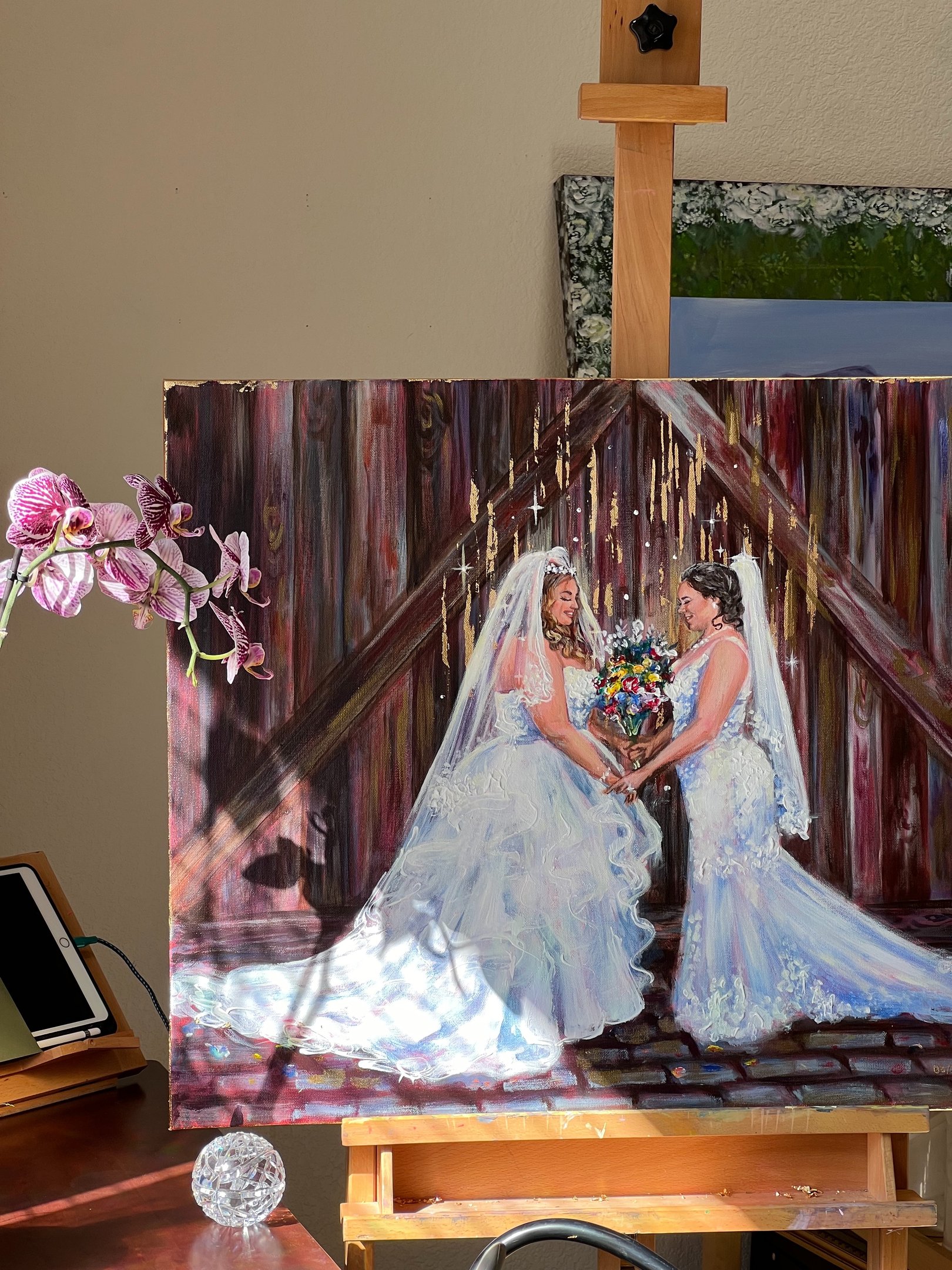 Beautiful two brides looking at each other in Live wedding painting by Nominsstudio.com