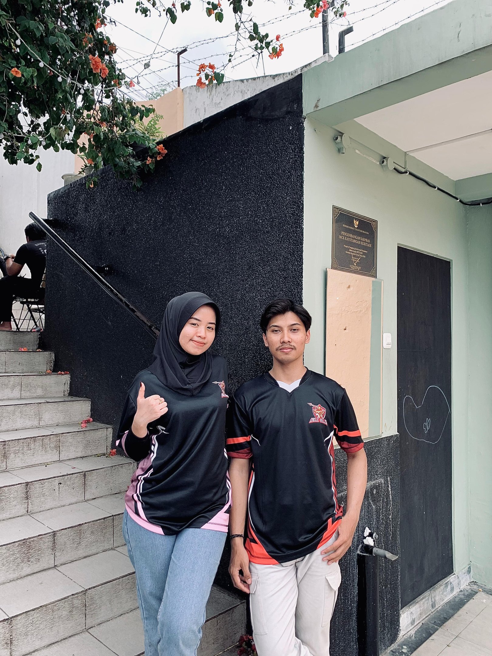 a man and woman standing next to each other