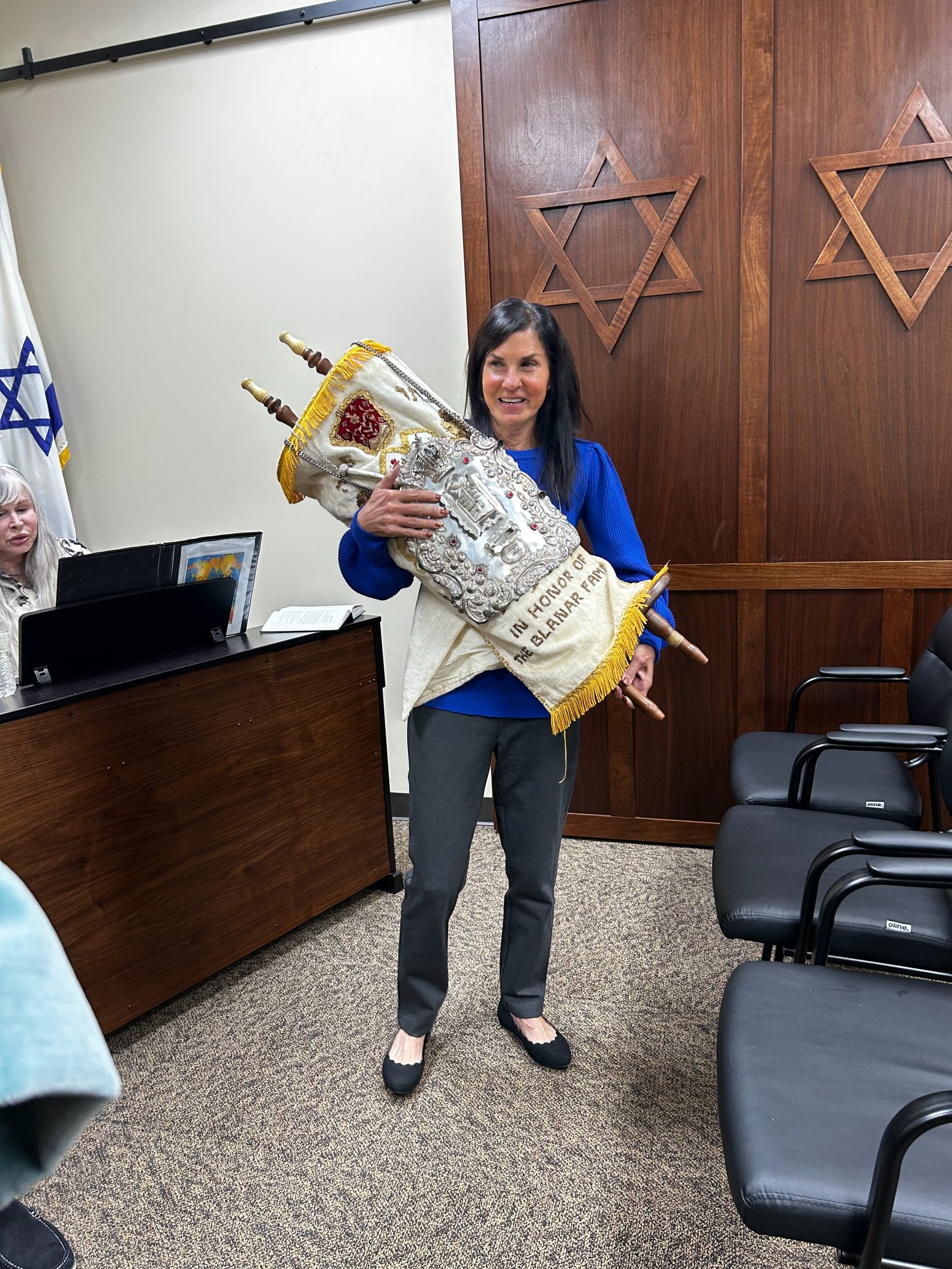 holding a torah
