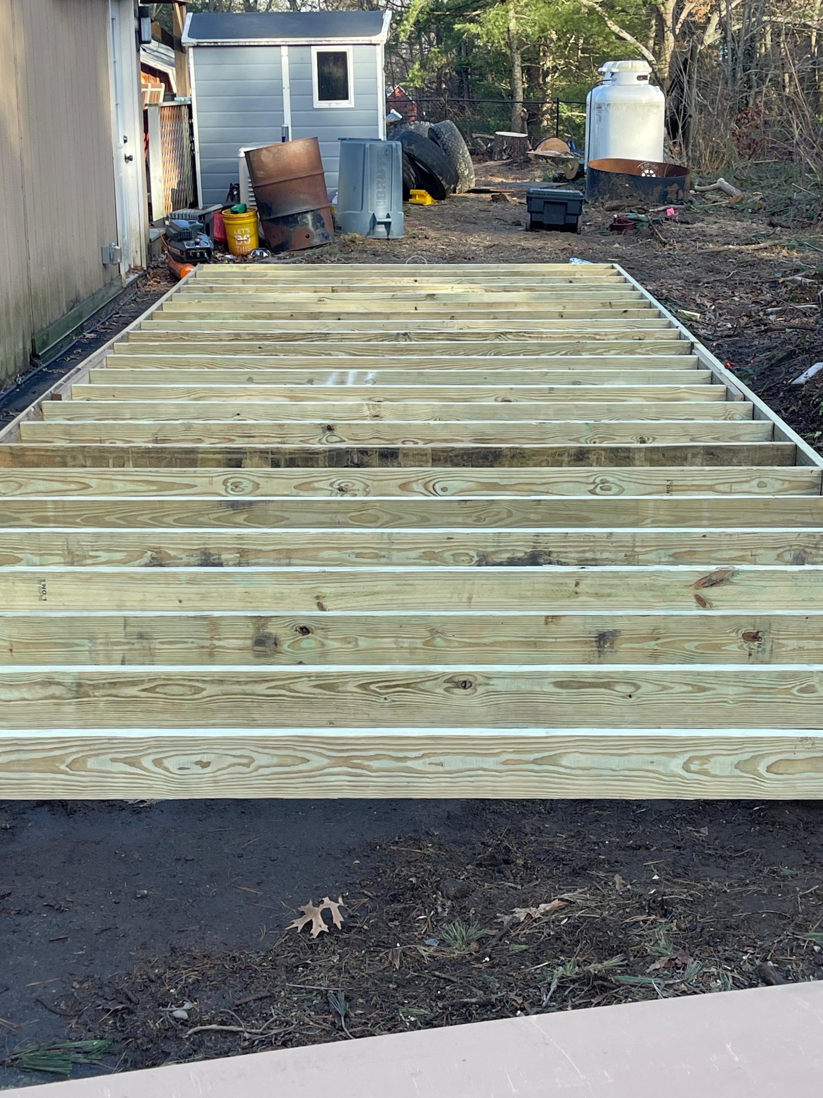 Pressure-treated 2x6 floor joists spaced 16" on center for maximum shed durability and long-term structural support