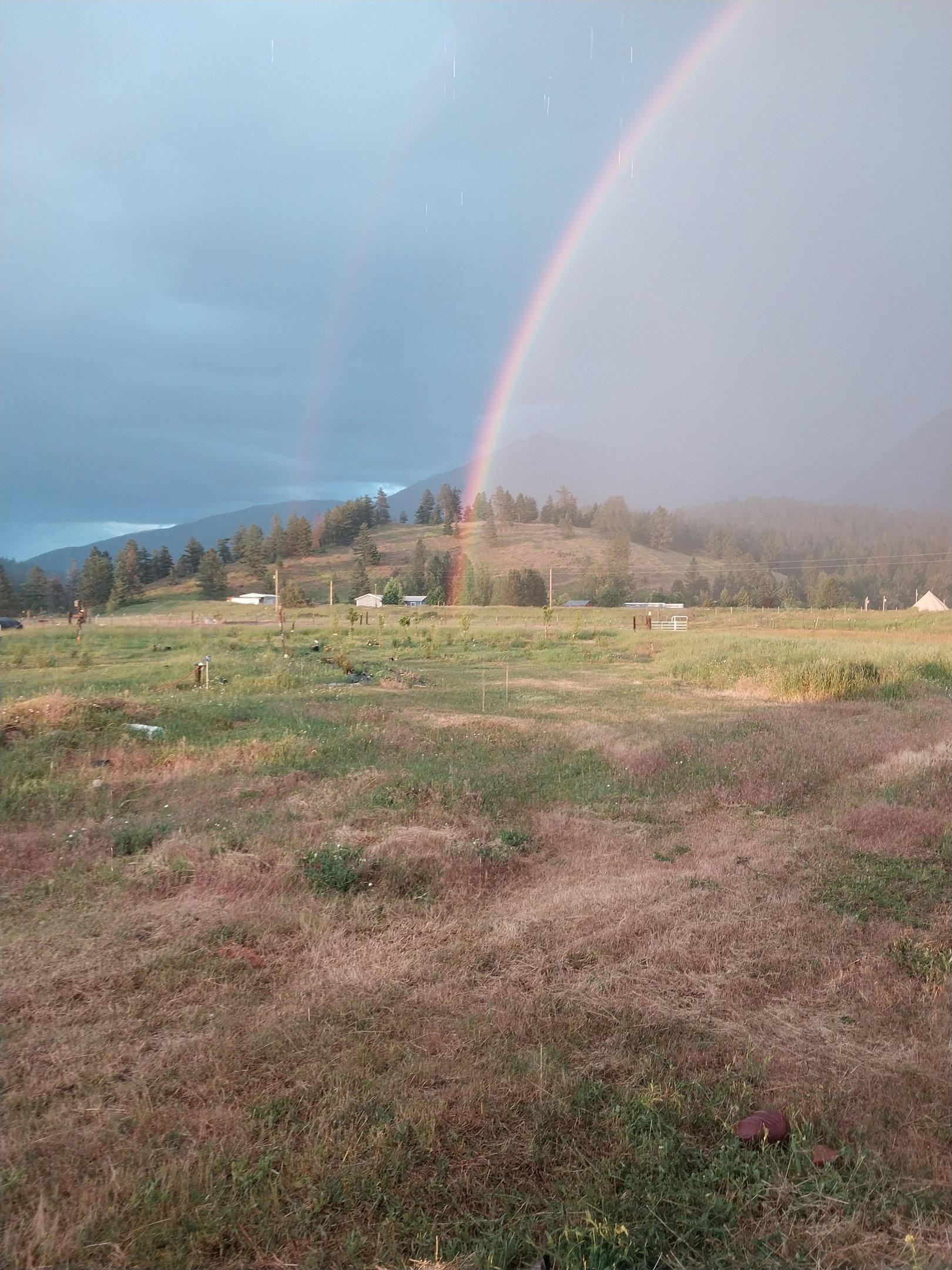 Double rainbow over the mountaons