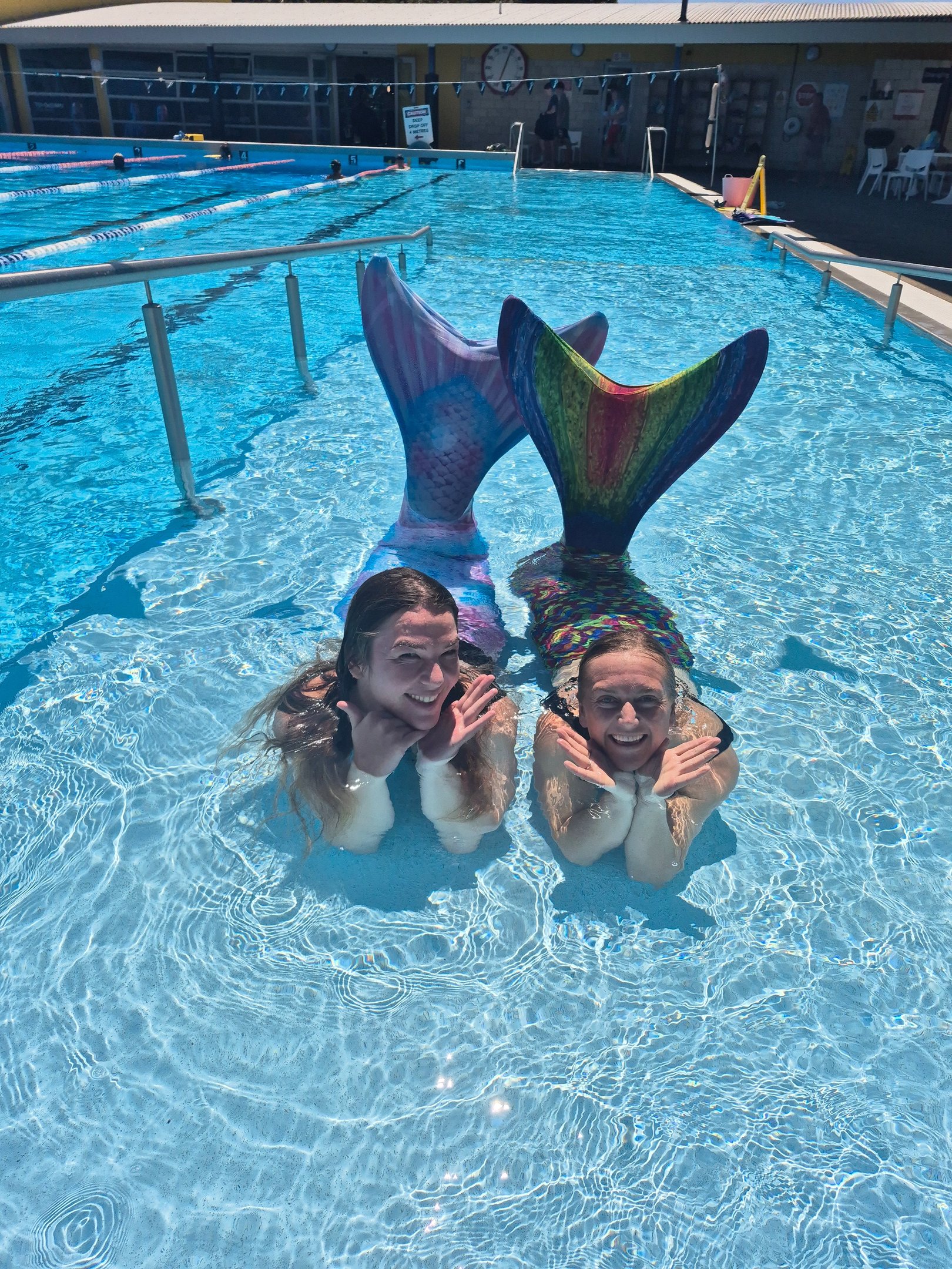 Adult Mermaids in a pool