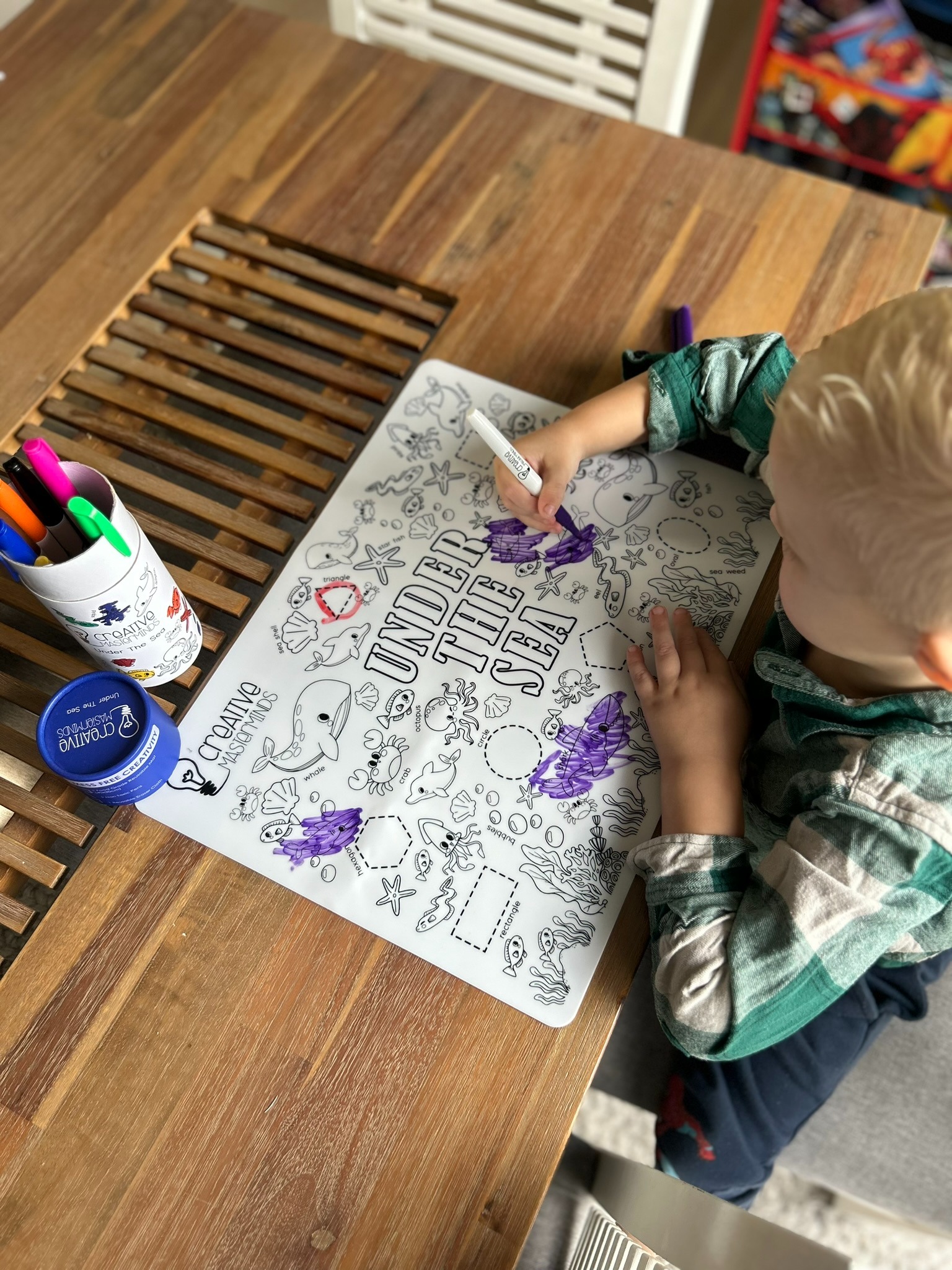 Non-toxic markers, eraser cloths, and storage tubes included with Scribbly Kids reusable drawing mat