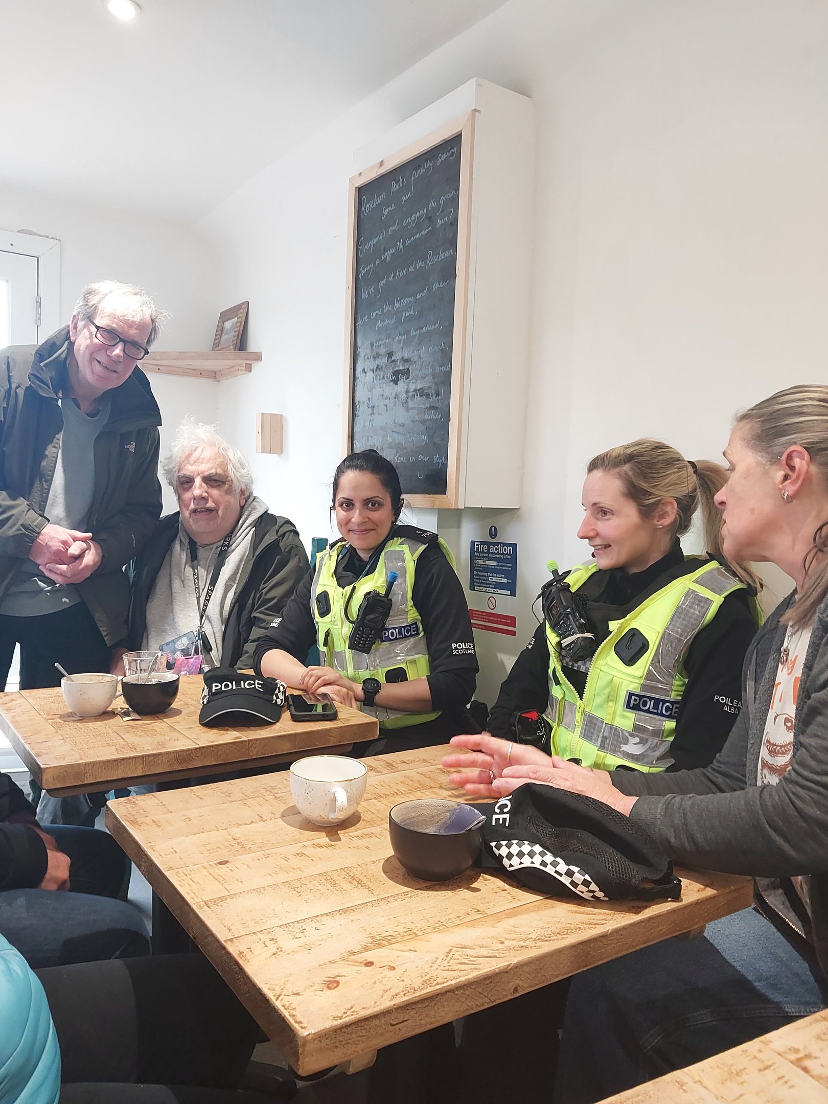 Members of the public with community policing team in coffee shop