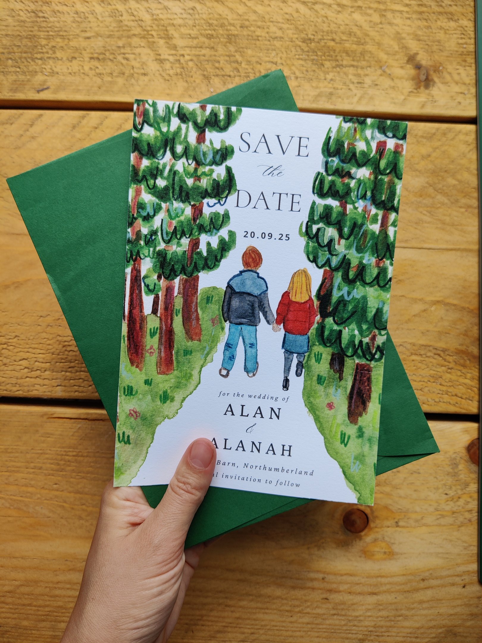a save the date of a couple walking in the woods 