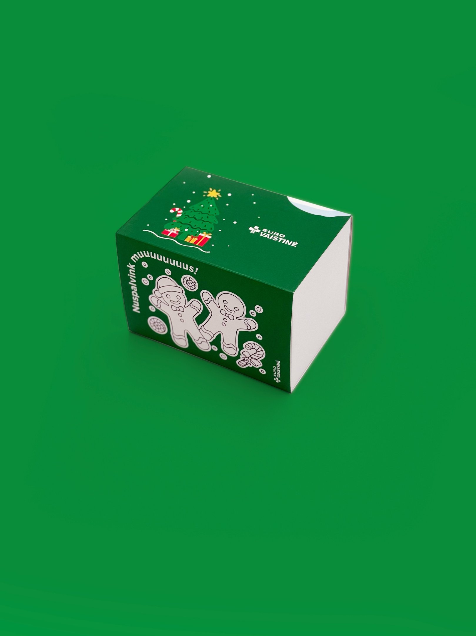 Custom green Eurovaistine pharmacy box with Christmas tree and gingerbread men illustrations.