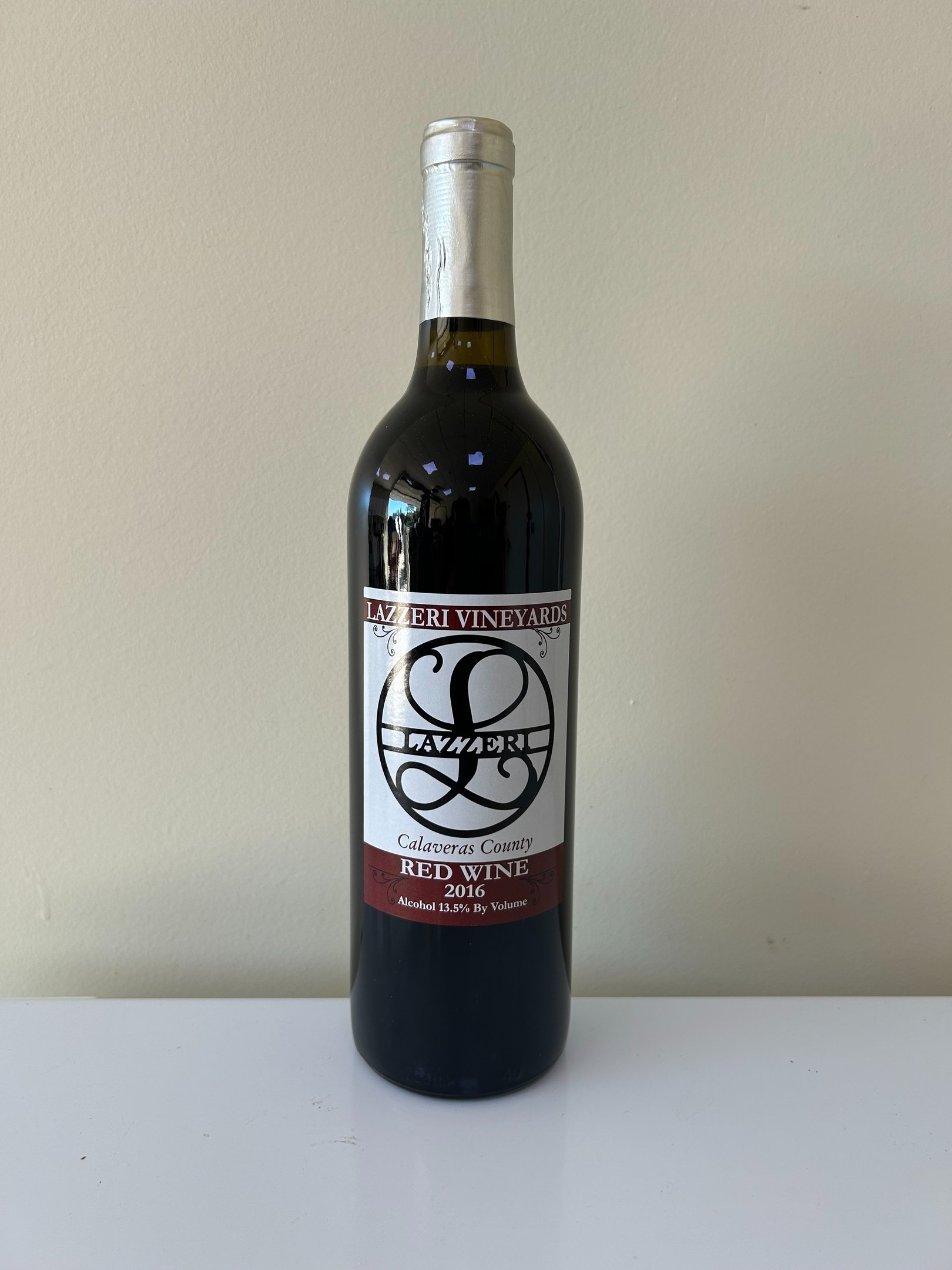 A close up picture of a wine bottle labeled 2016 Red Wine