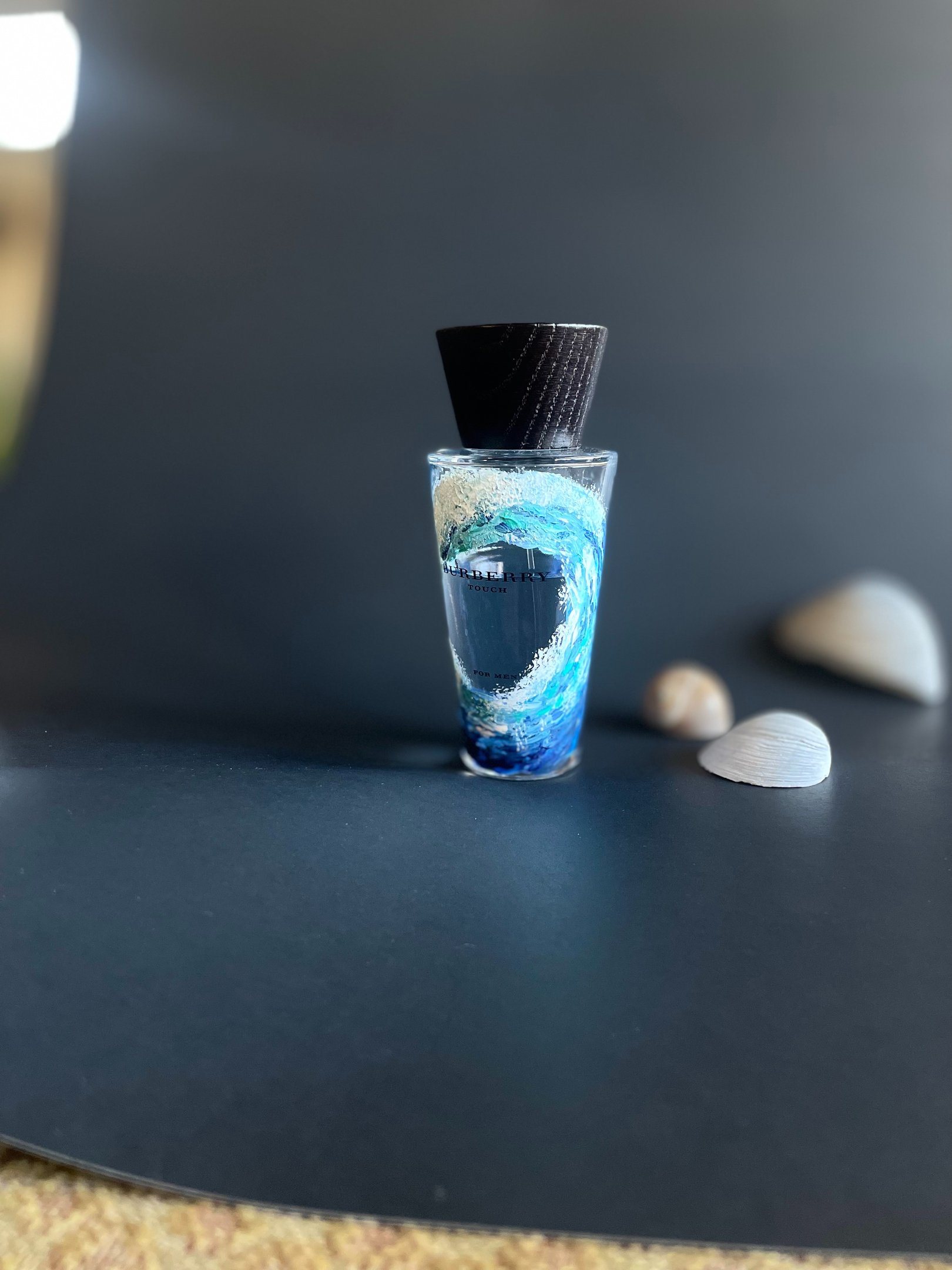 His perfume bottle with rising ocean wave painted on it for a beautiful luxurious gift creating last