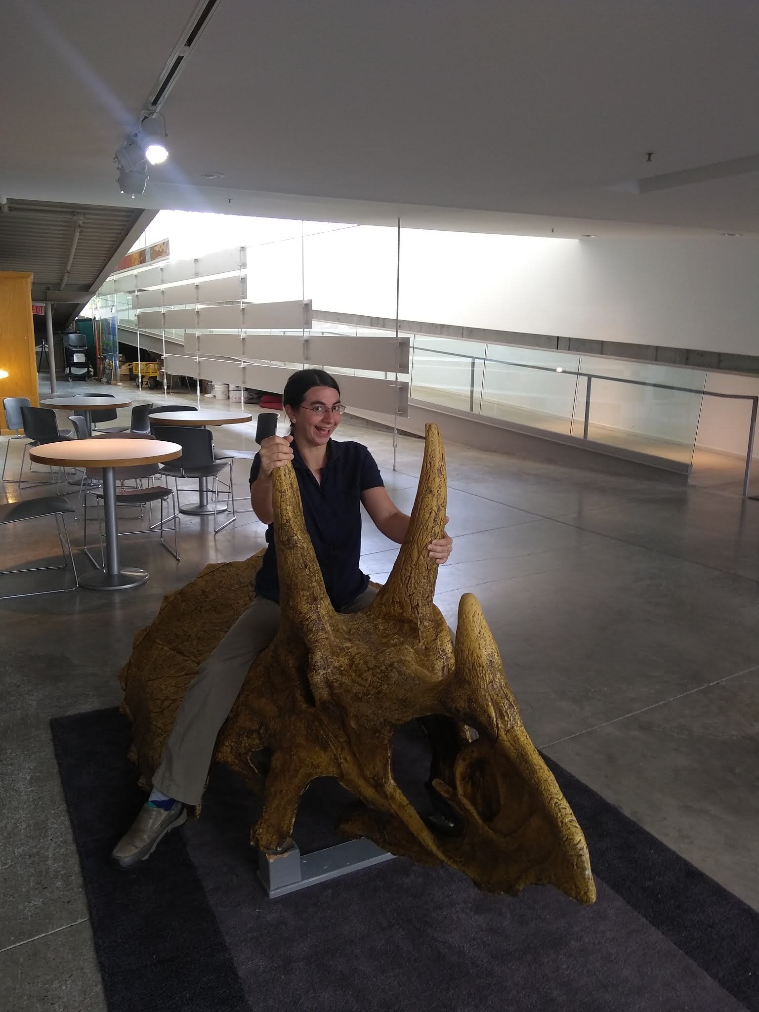Andrielle riding triceratops skull
