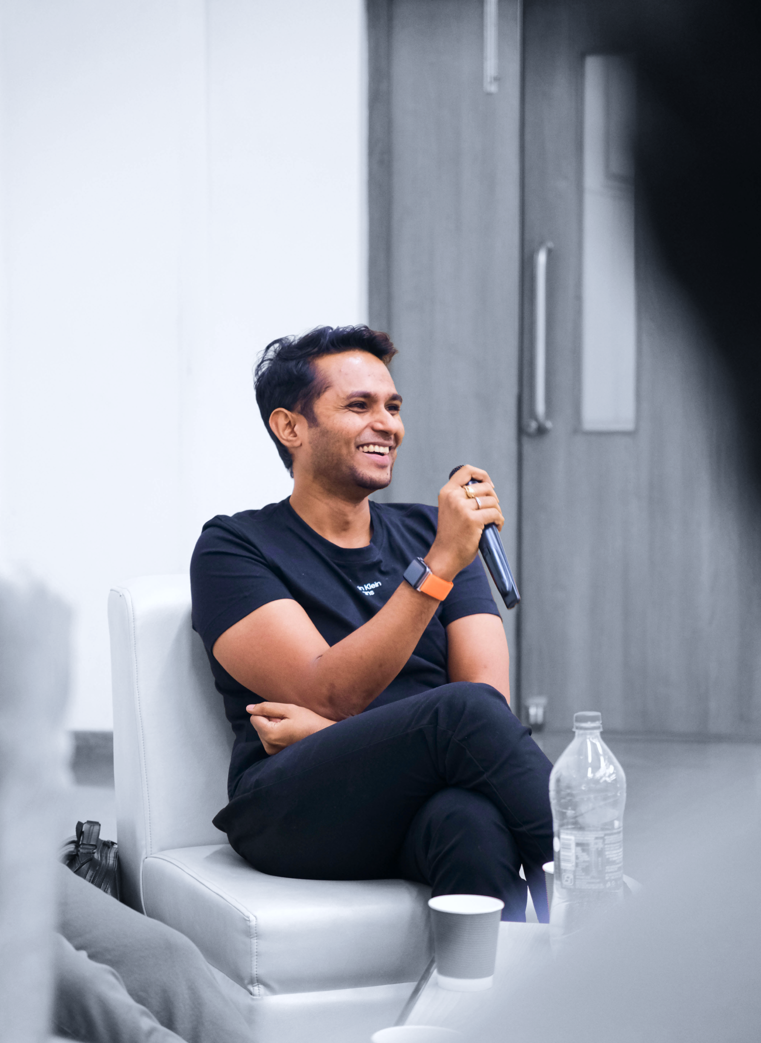 a man sitting on a chair in a room