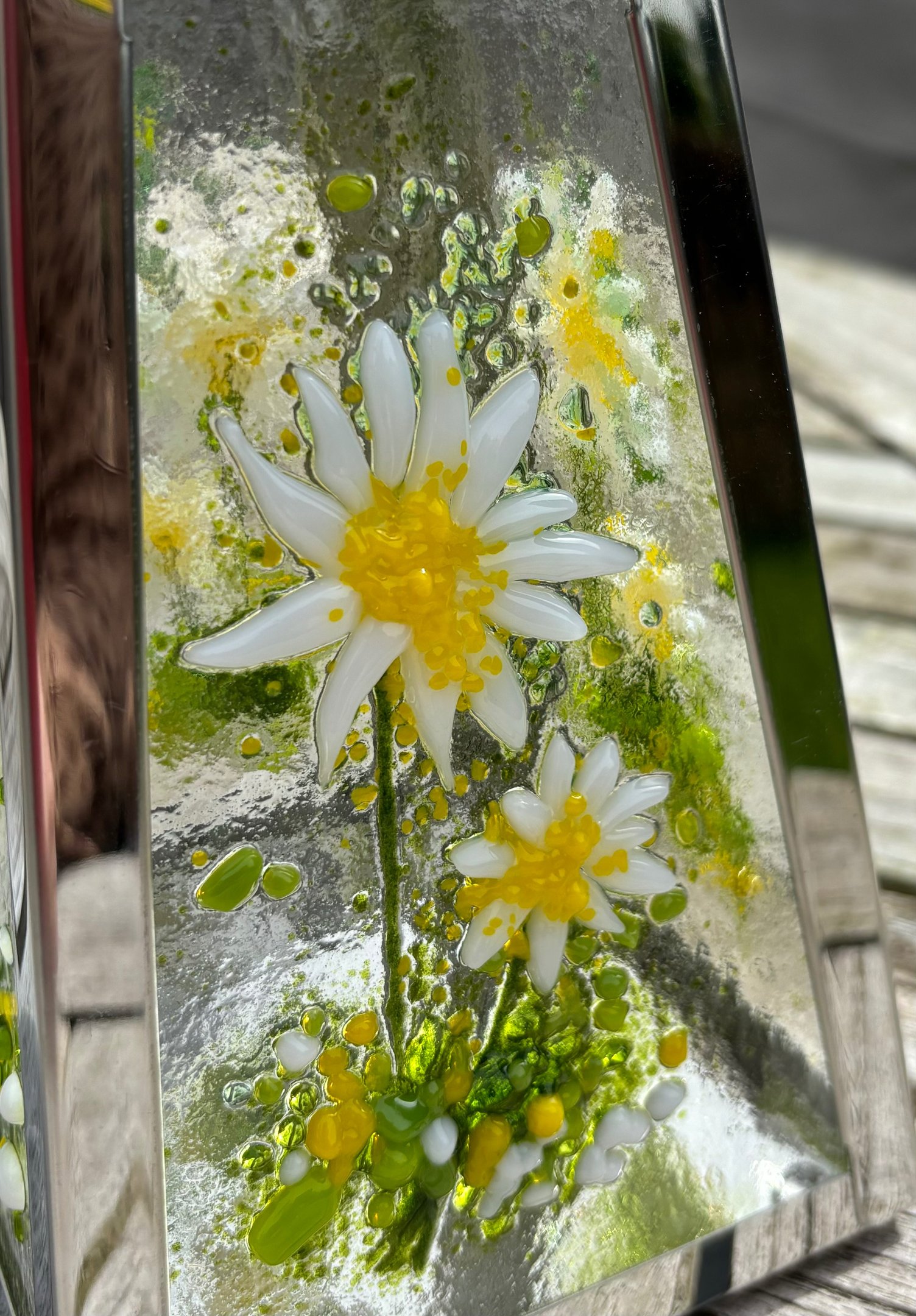 a picture made from fuse glass with flowers