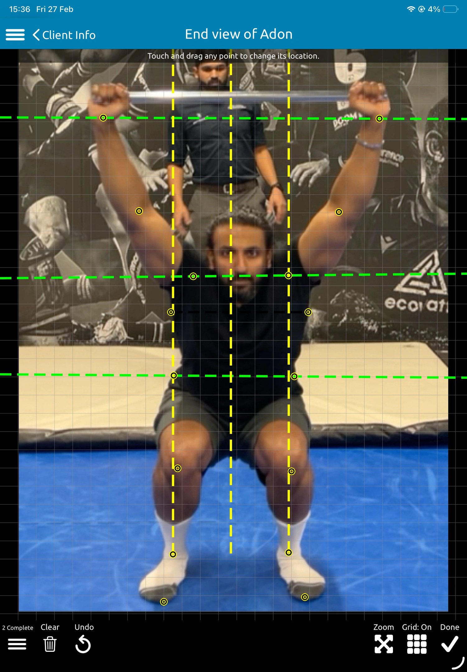 Physiotherapist performing posture and movement assessment to guide rehabilitation in Neath