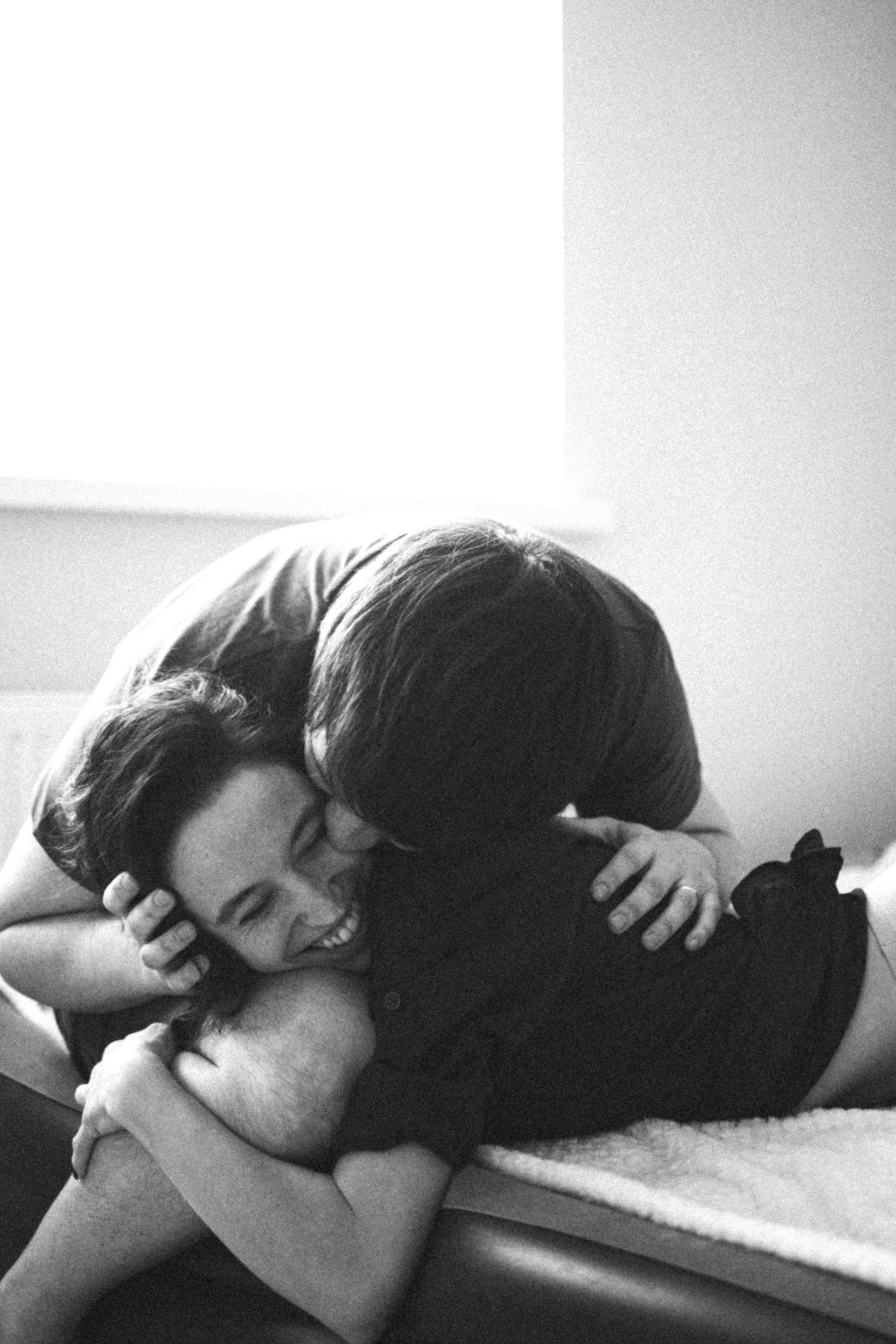a man and woman who met on piano piano, kissing on a bed
