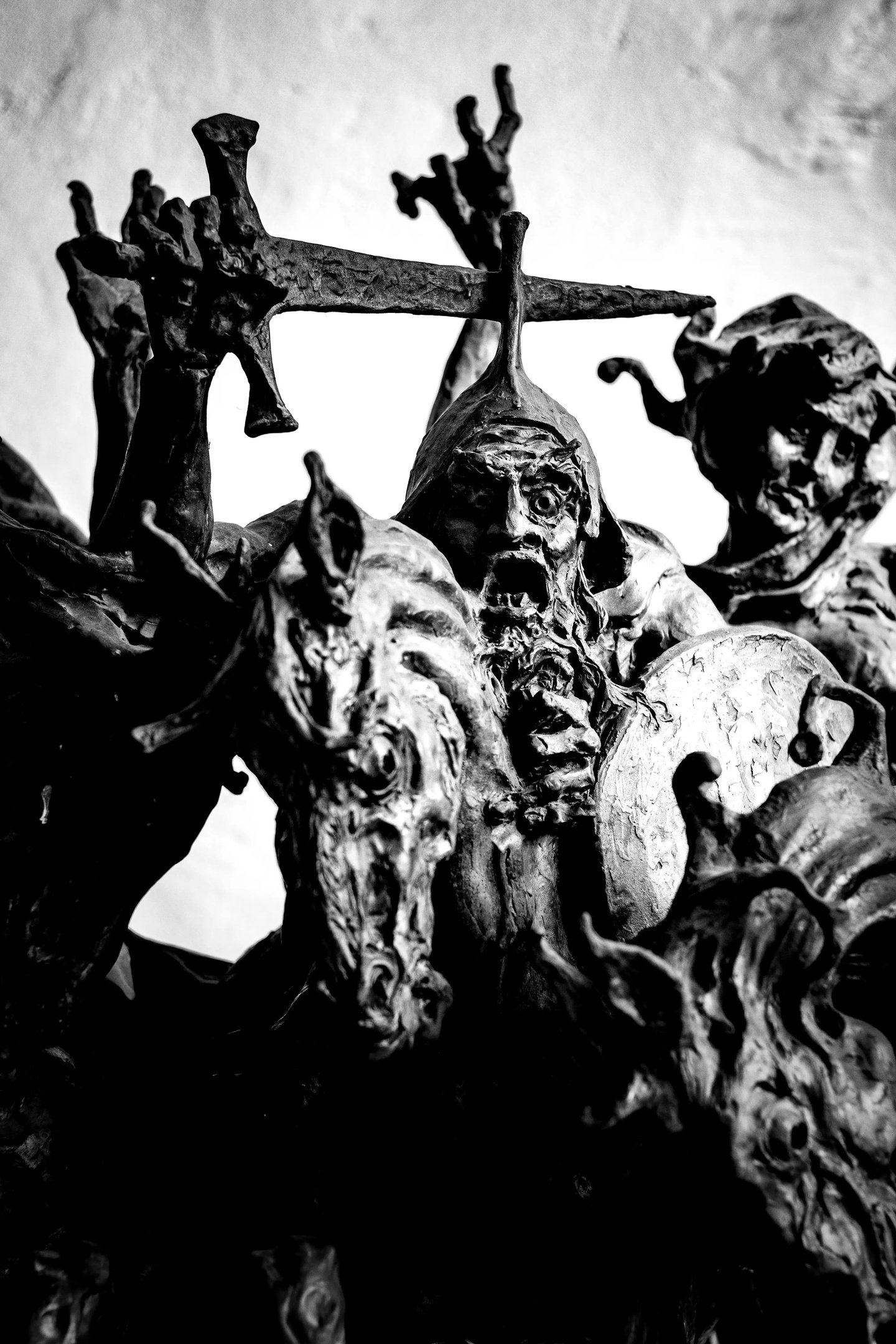 a statue of a man with a sword and a sword the four horsemen of apocalypse