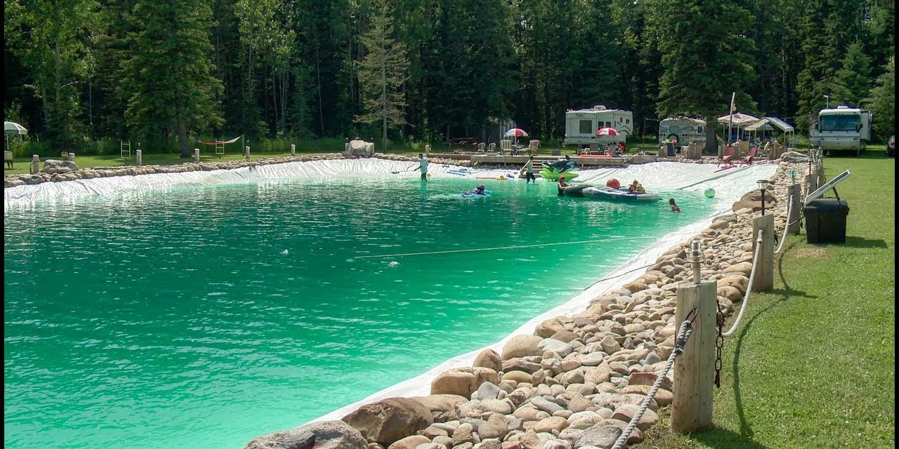 Large natural swimming lake — engineered for clarity and ecological balance
