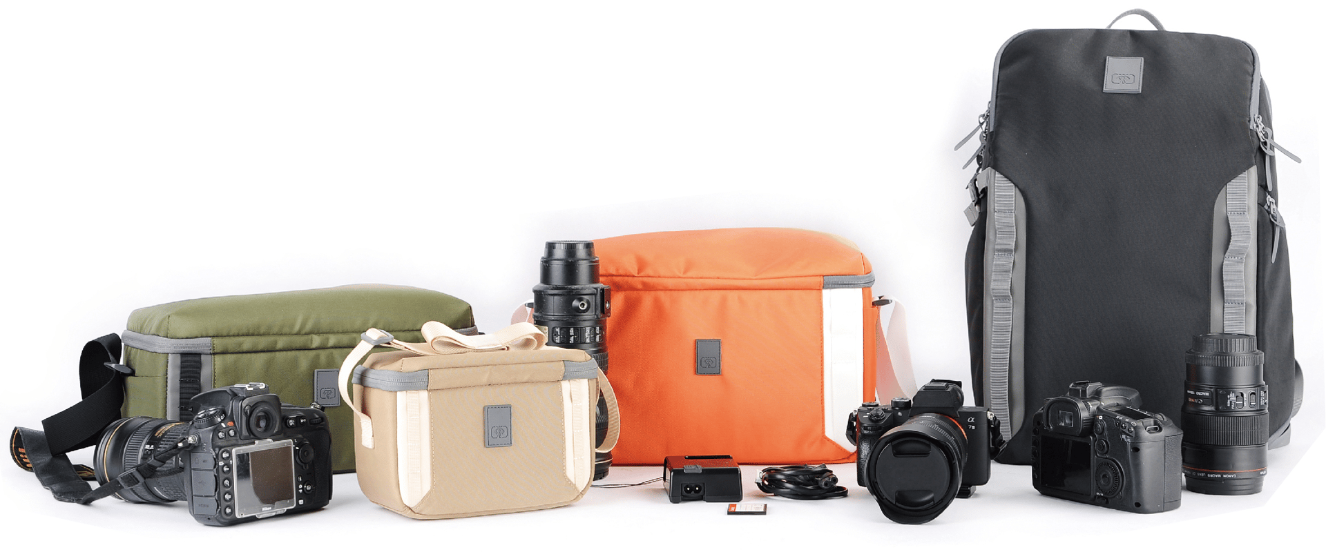 A collection of camera bags and equipment displayed against a white background. 