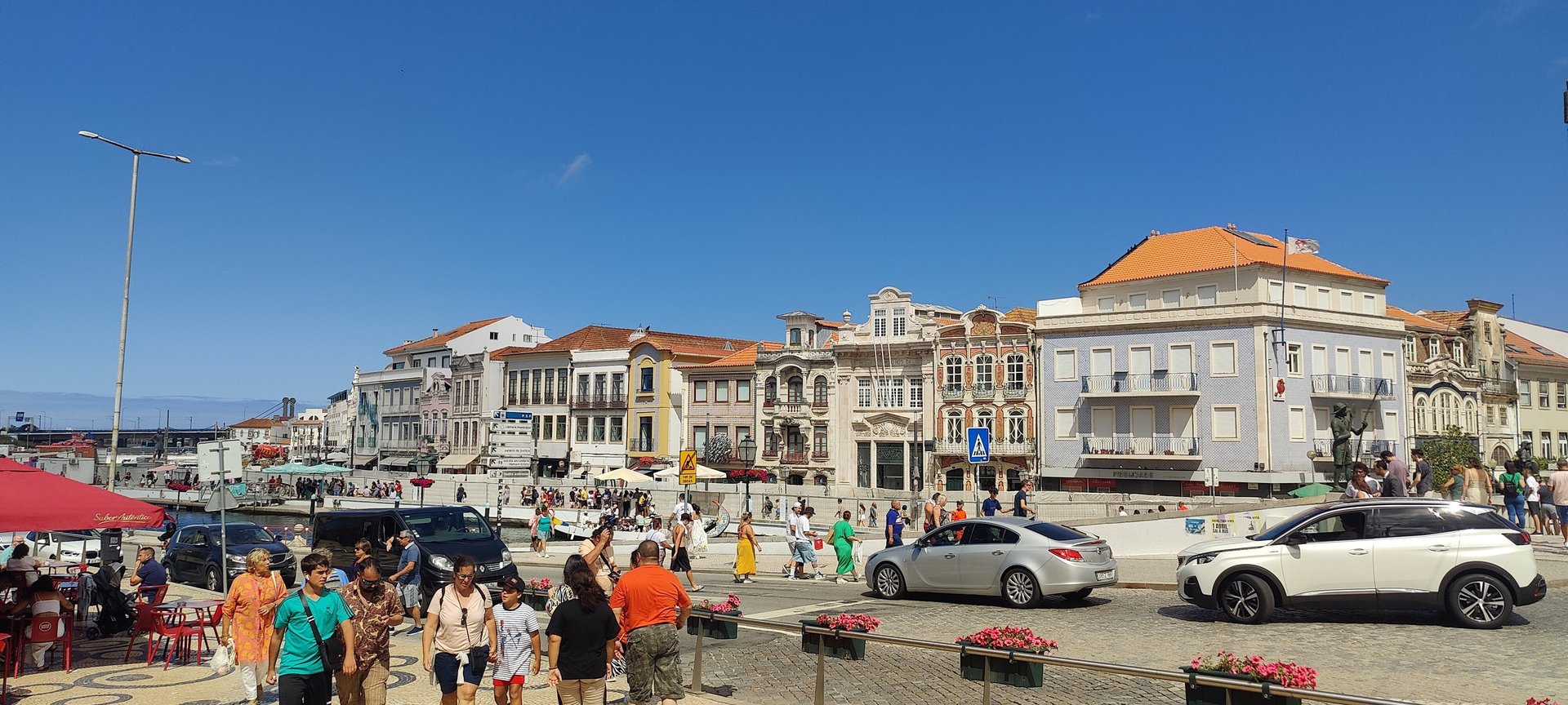 a group of people standing around a city street