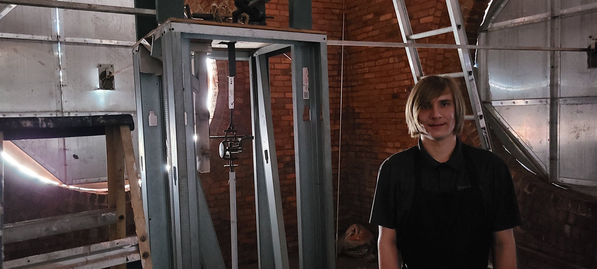 The owner of the lutz clock company inside a tower clock