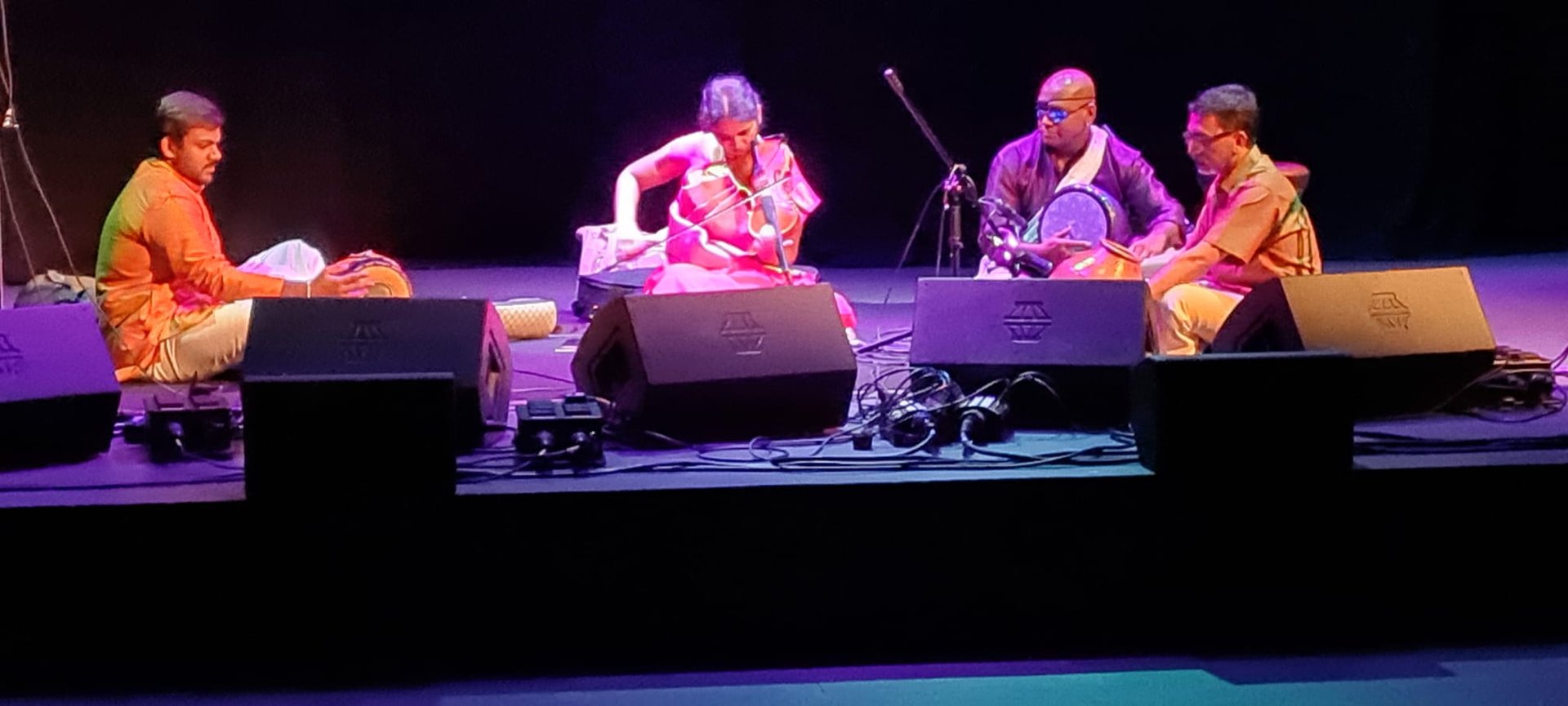 A picture of artists performing in an auditorium