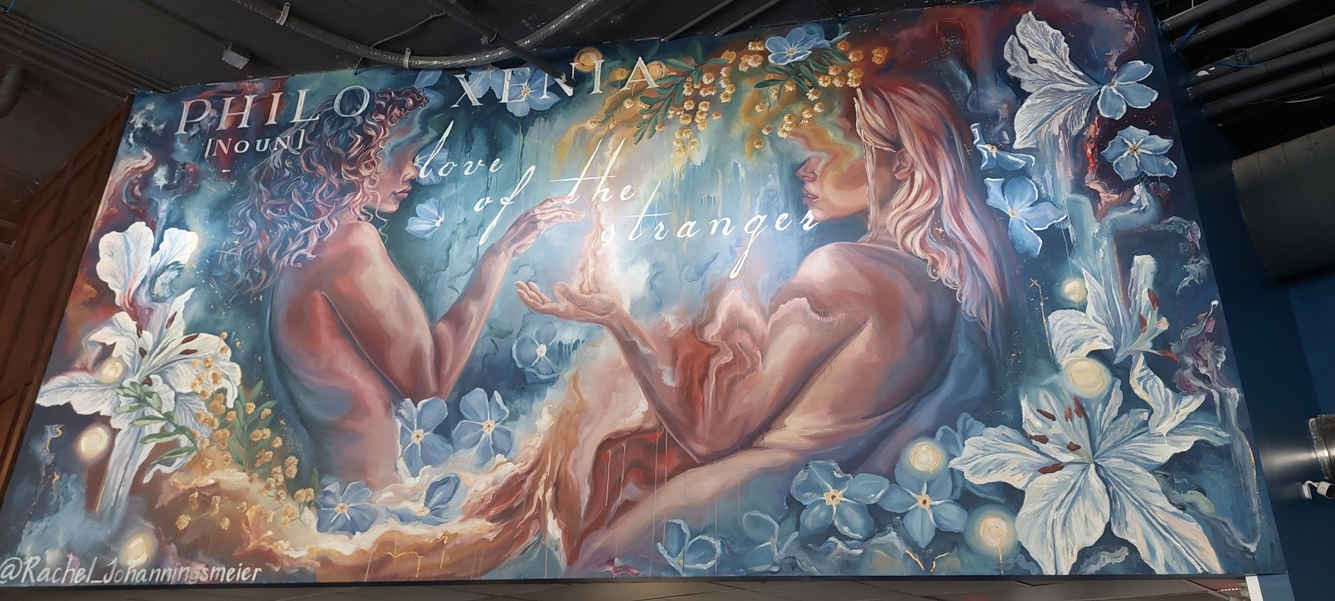 mural of two ethereal figures at Flour & Barrel Kitchen