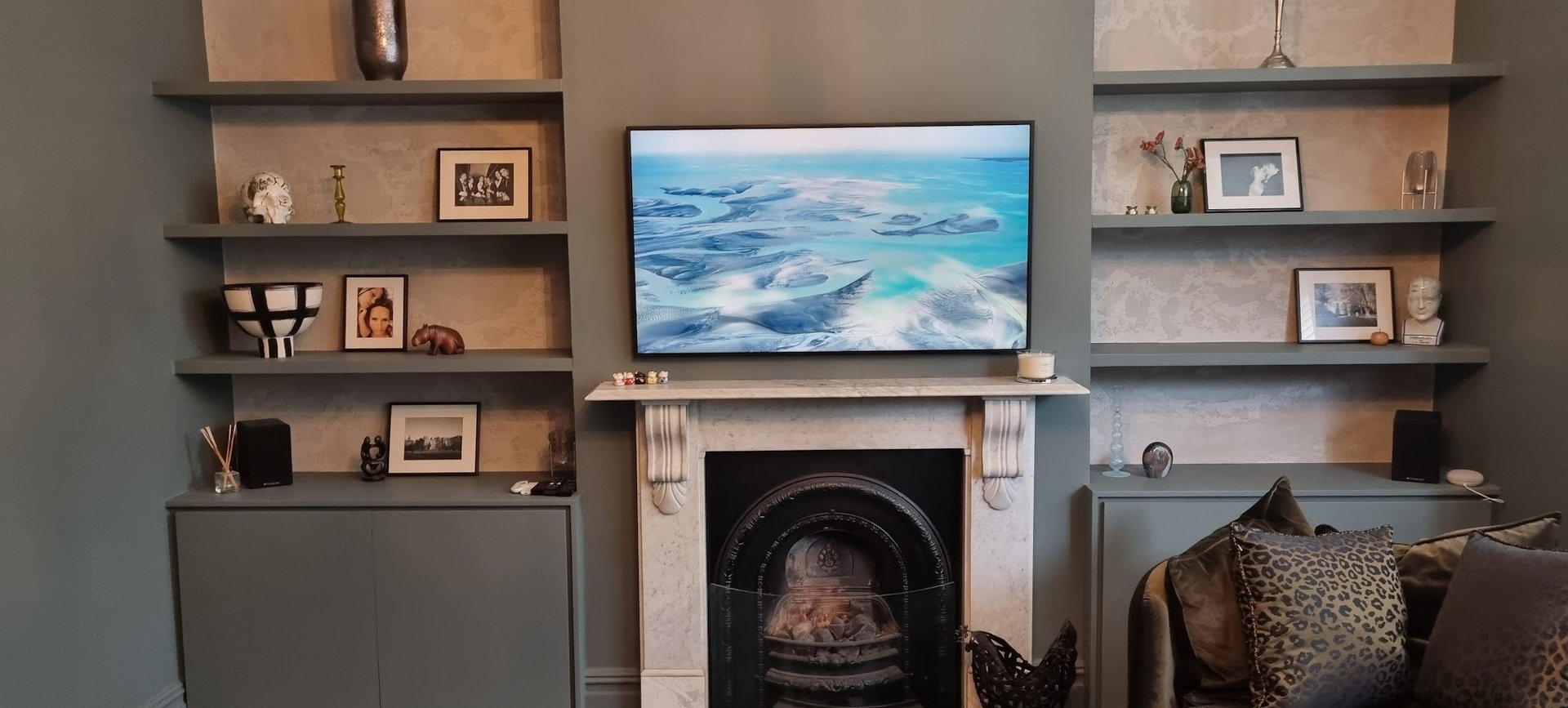 TV wall mounting above an ornate fireplace in Milton Keynes with hidden cables.