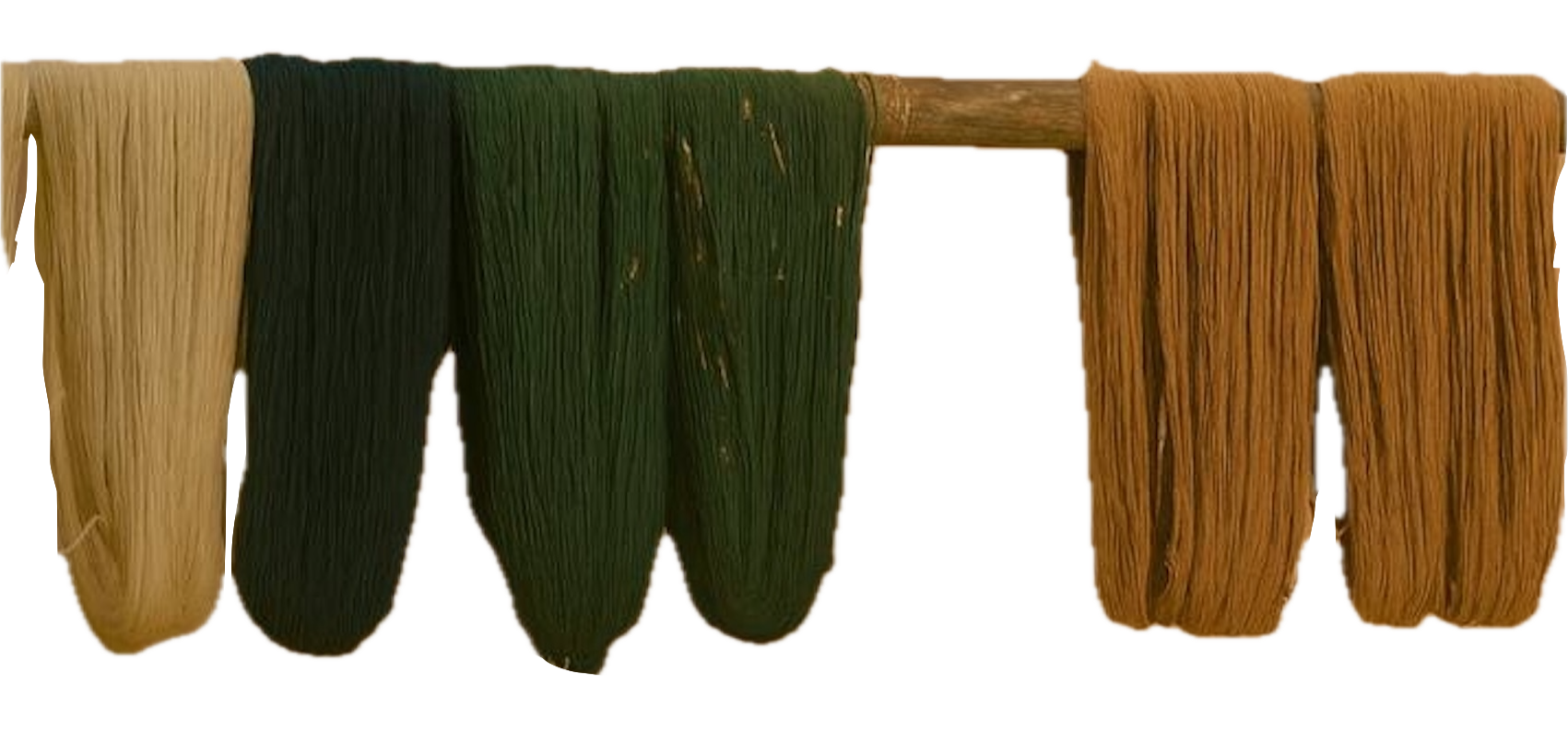 Hand- dyed wool yarns drying on a wooden frame