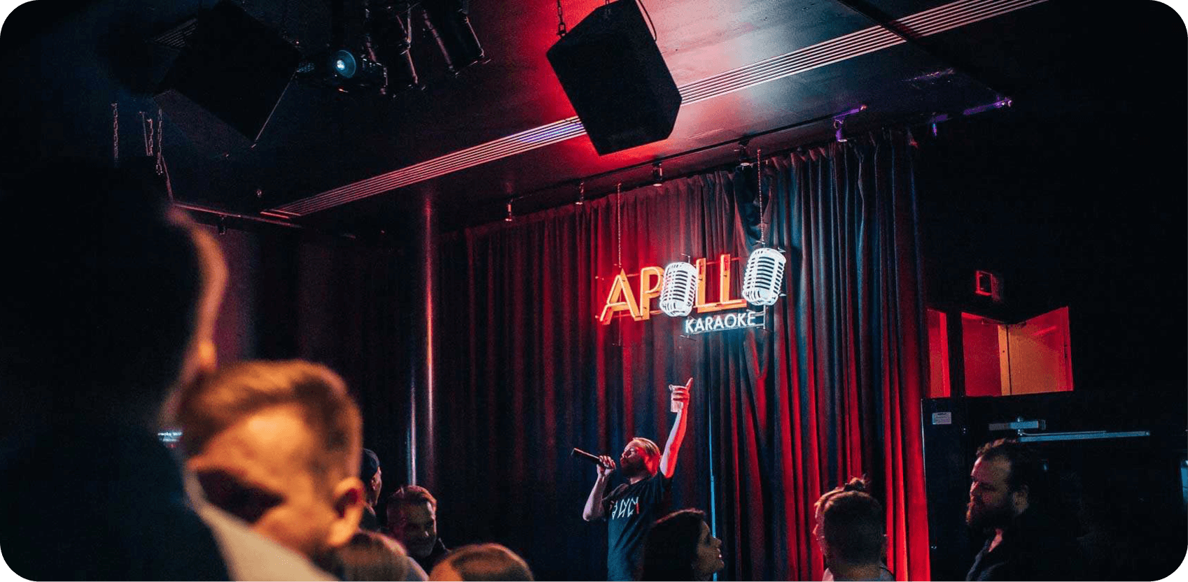 A man performing at Apollo Karaoke bar