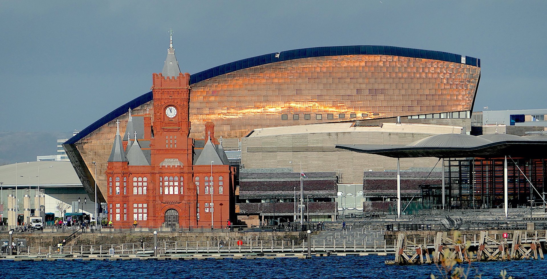 The Pierhead Building and Wales Millennium Centre in Cardiff Bay at sunset.