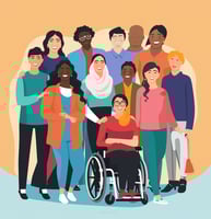 a group of people standing around a person in a wheelchair