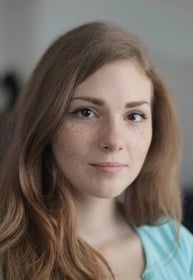 a woman with long hair and blue eyes