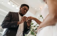 a multi-faith couple exchanging rings on their wedding day