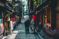 people walking down streets in asia