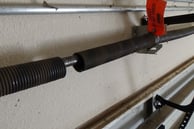 Broken garage door torsion spring