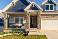 a house with a garage door and a garage door