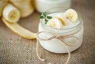 a jar of yogurt with bananas and yogurt