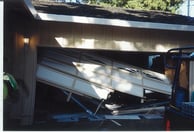 Repair garage door damaged by car crash.