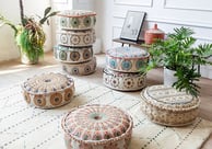 a living room with a ottoman