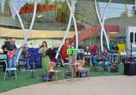 a band playing music in a large outdoor area