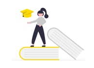 a woman in a graduation cap and gown standing on a book