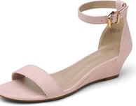 a woman's pink wedged sandal with a gold buckle