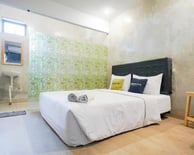 flazale reddoorz flash sale promo a bedroom with a bed and a television