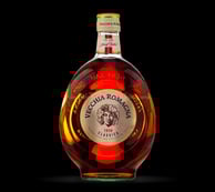 a bottle of brandy with vecchia romagna classic emblem on it
