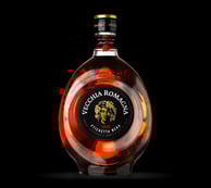 a bottle of brandy with vecchia romagna black label emblem on it