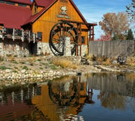 photograph of wooden house with wheel from travels to nebraska