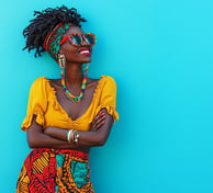 a woman with a bright yellow top and a bright blue background