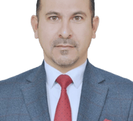 a man in a suit and tie with a red tie