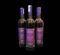 three bottles of donelli bevanda arromatizza wine with a purple label on them